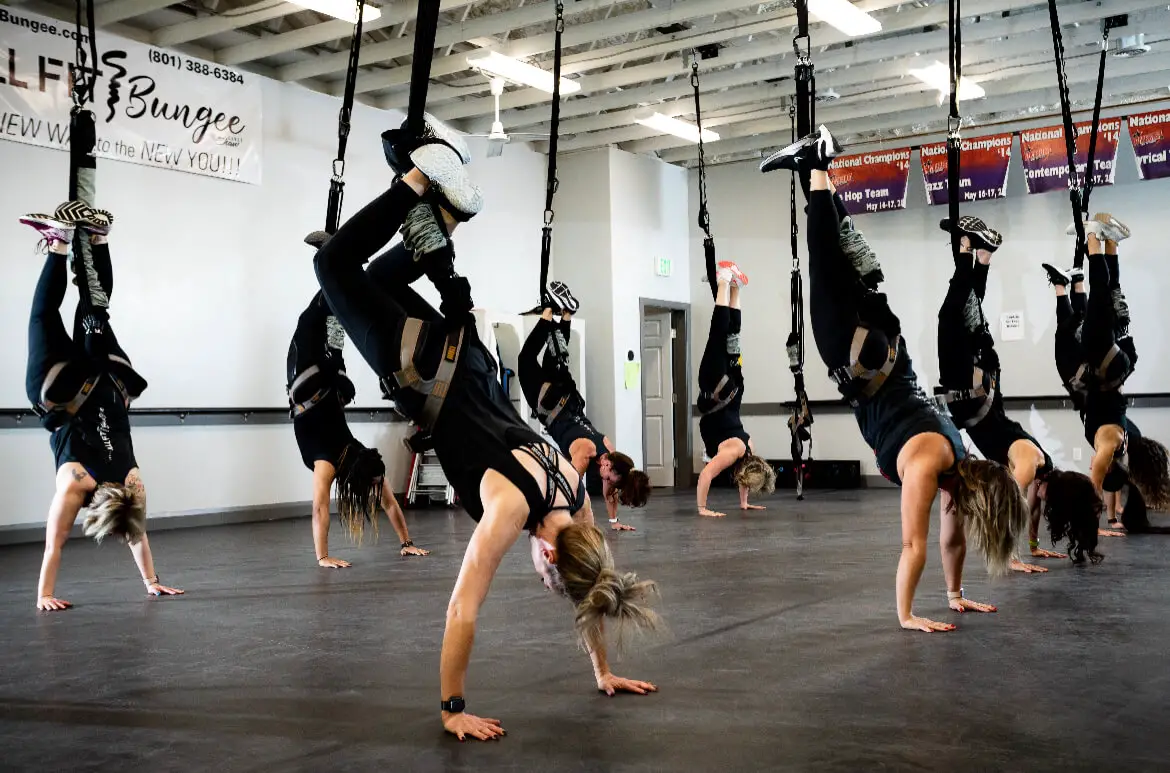 group of women upside down at an All Fit Bungee class